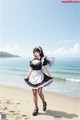 A woman in a maid outfit standing on a beach.